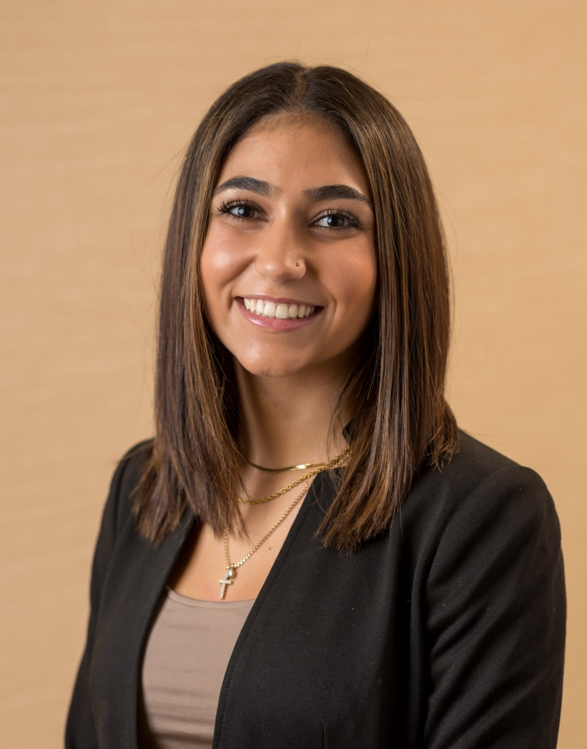 Ava Genova, a mixed-race student in a black blazer